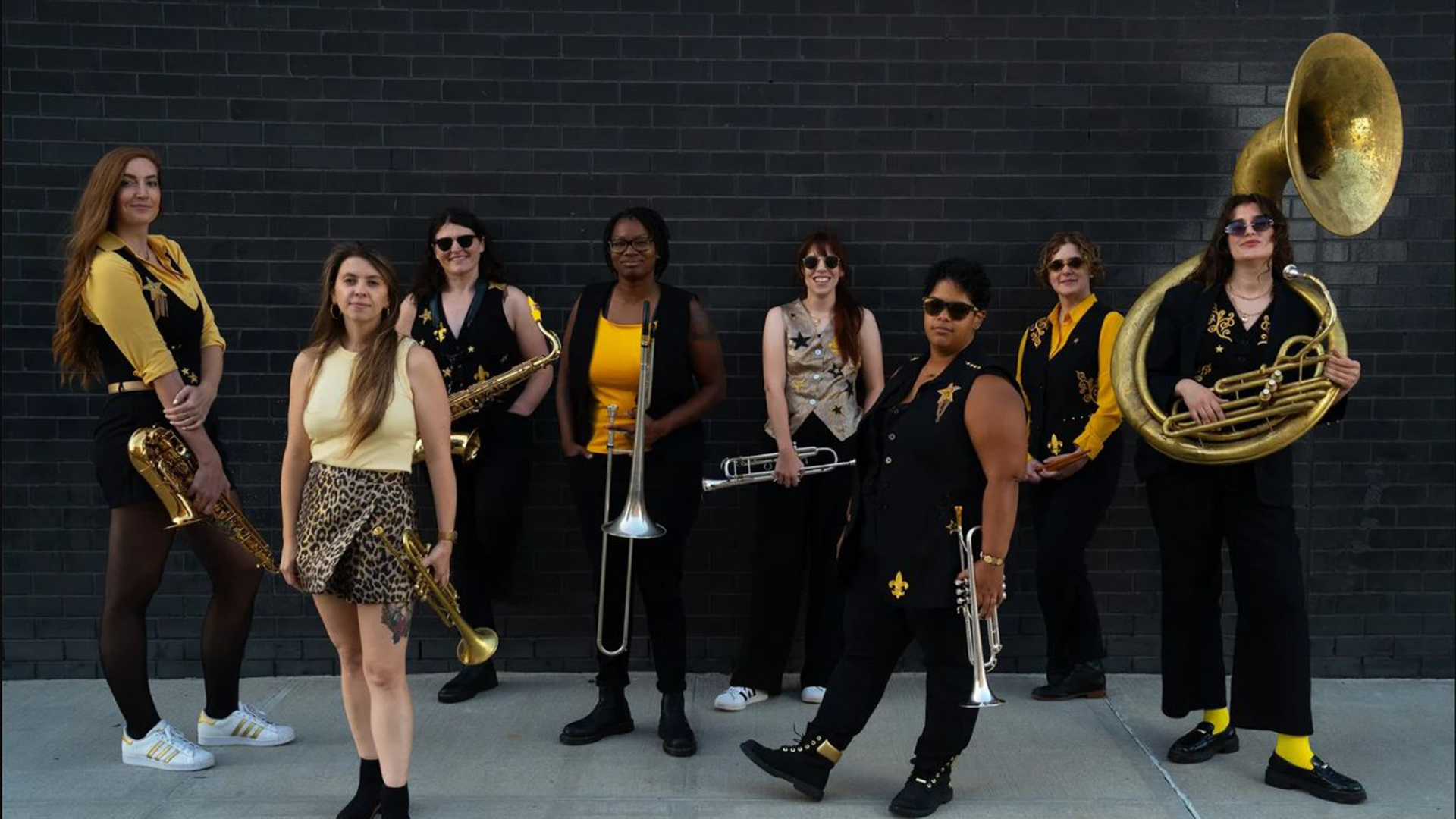 people posing with musical instruments