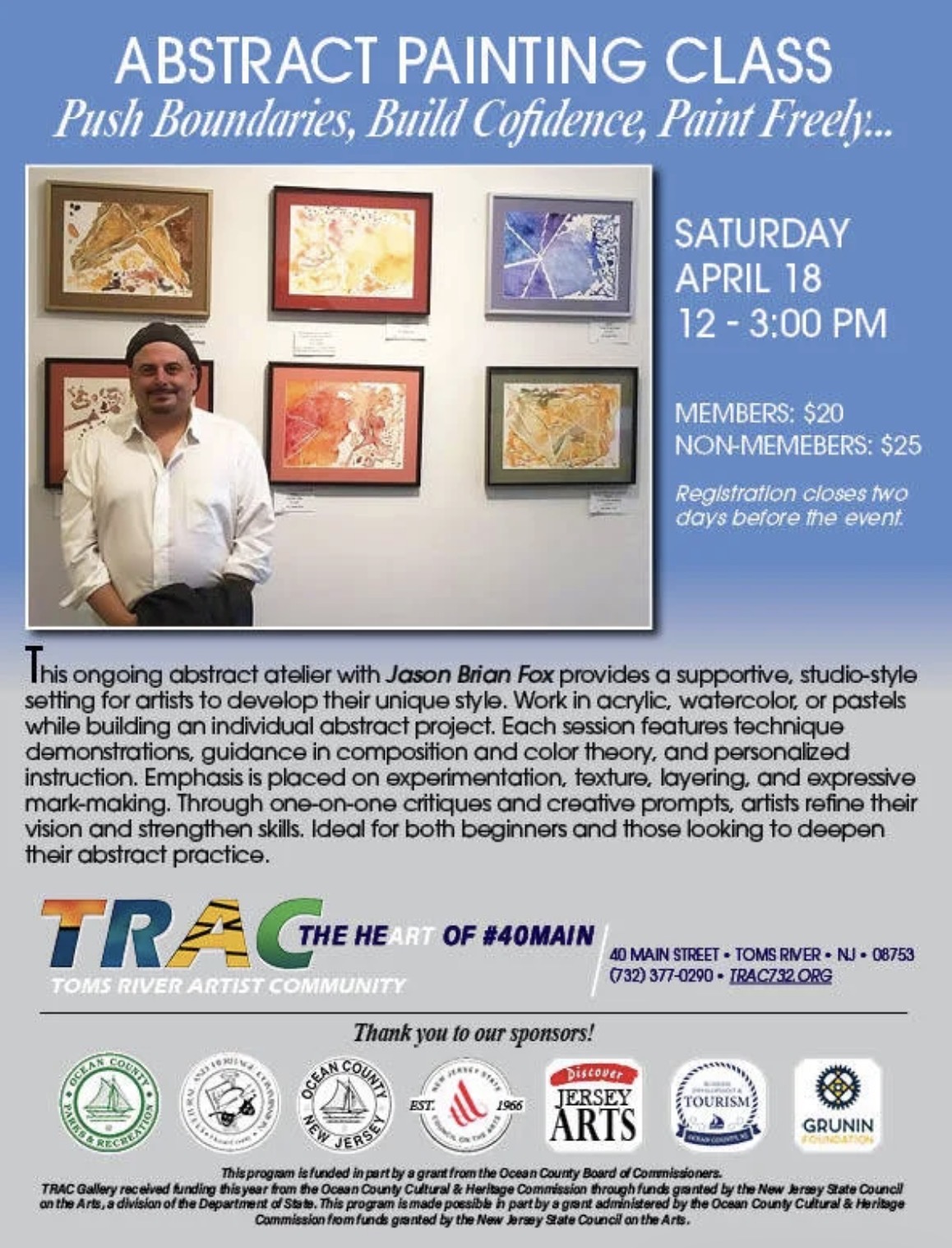 man standing in front of paintings in art gallery