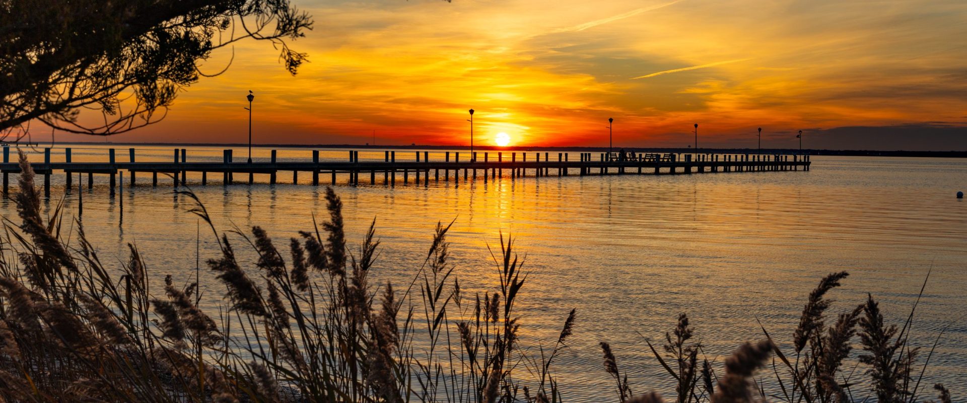 Sunset photo of dock and water
