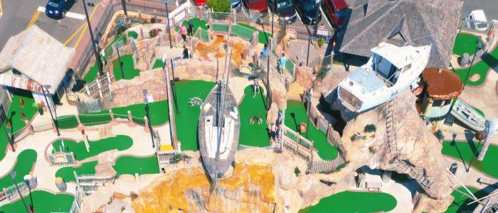 Aerial view of wave pool and mini golf course at Breakwater Beach