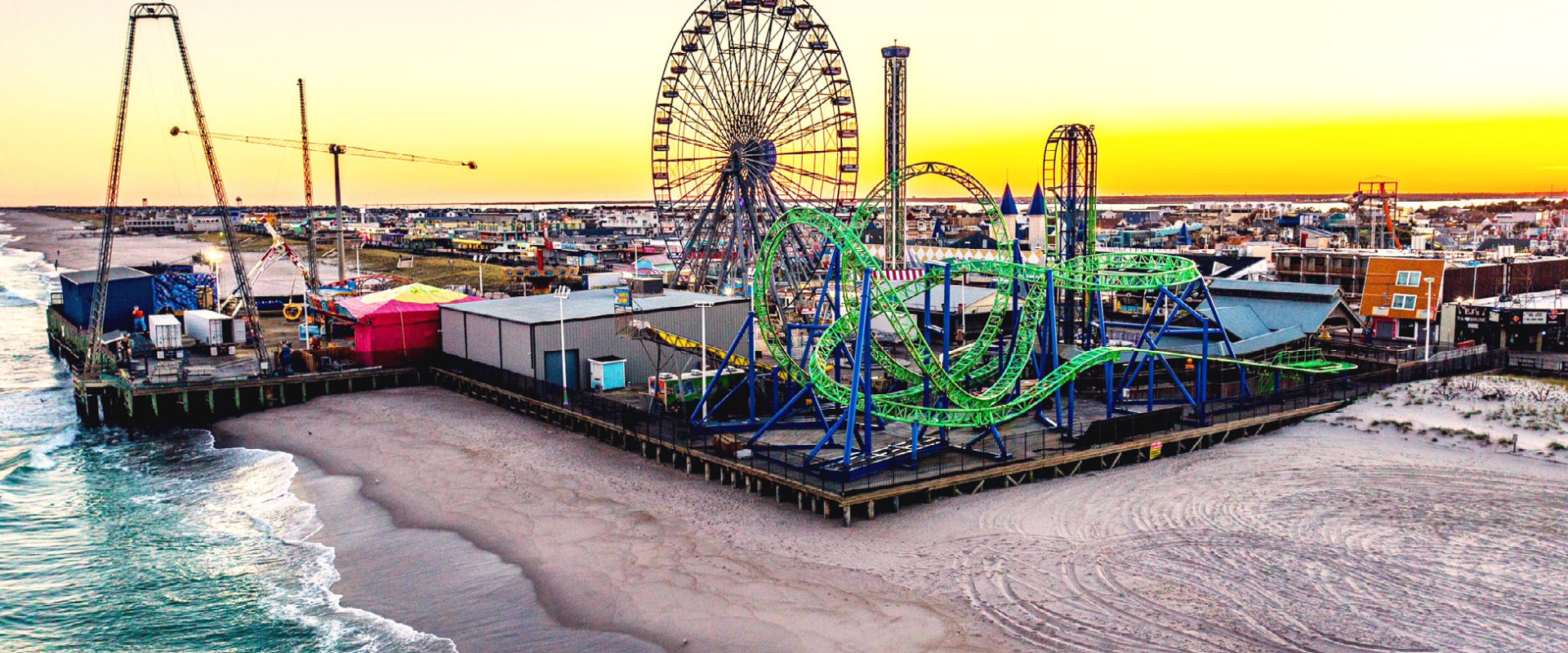 Boardwalk rides at Seaside Heights Boardwalk with ocean and beach