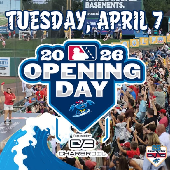 People sitting in bleachers at Jersey Shore BlueClaws stadium watching a baseball game