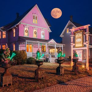 Pink building and a full moon in the night sky