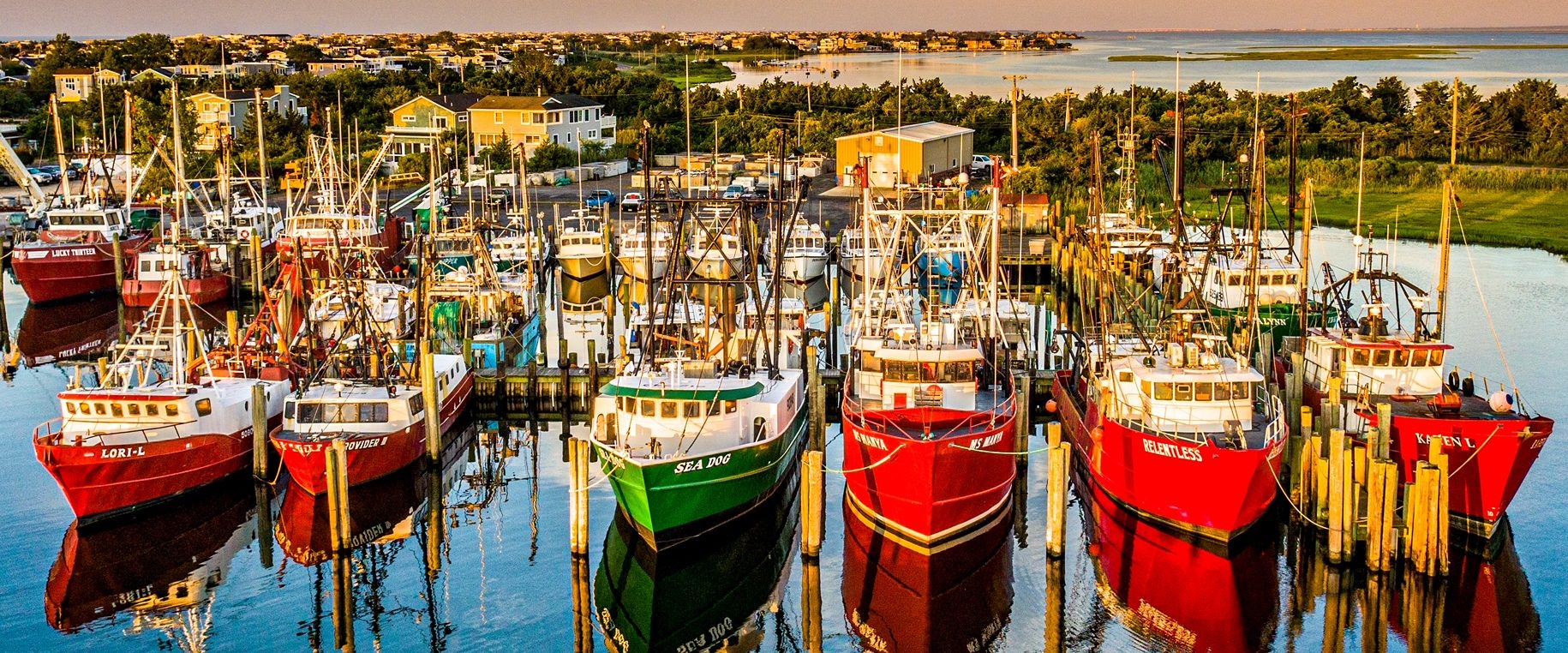Boats in water at a dock aerial view