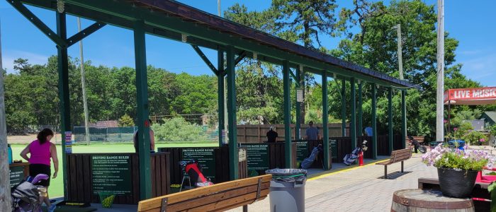 People at a driving range