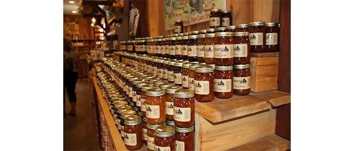 Jars of jam stacked on a shelf