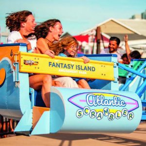 People riding on Atlantic Scrambler at Fantasy Island Amusement Park 
