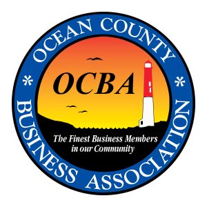 Ocean County Business Association logo with a lighthouse in the sunset and seagulls flying