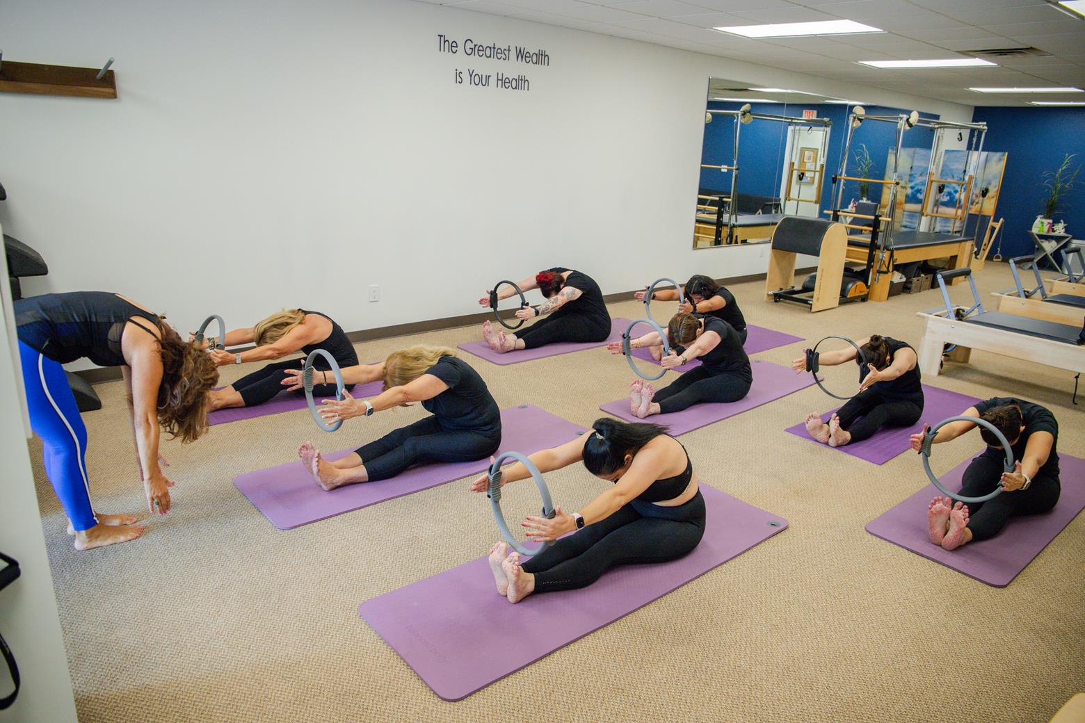 people taking a Pilates class