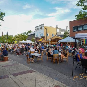 people sitting at tables eating in downtown toms river