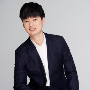 person in a white dress shirt and a suit 