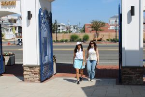 Two women walking through the gates at Fantasy Island Amusement Park