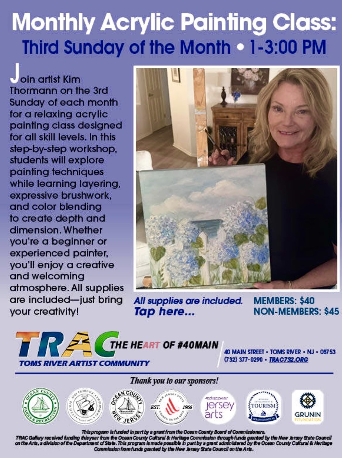 woman holding a painting of flowers and a white picket fence overlooking the ocean
