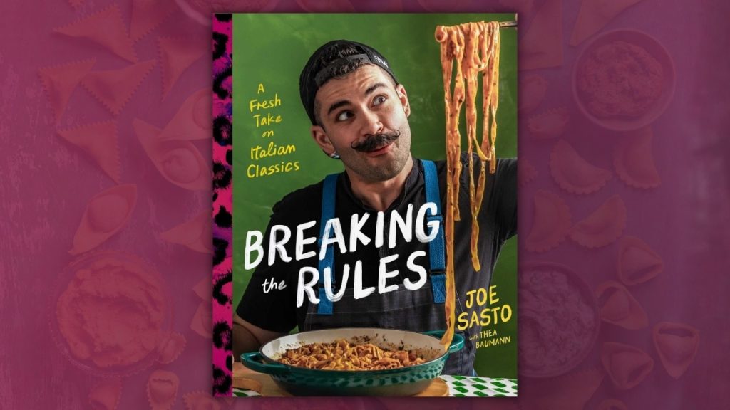 Man holding up pasta from a spoon 