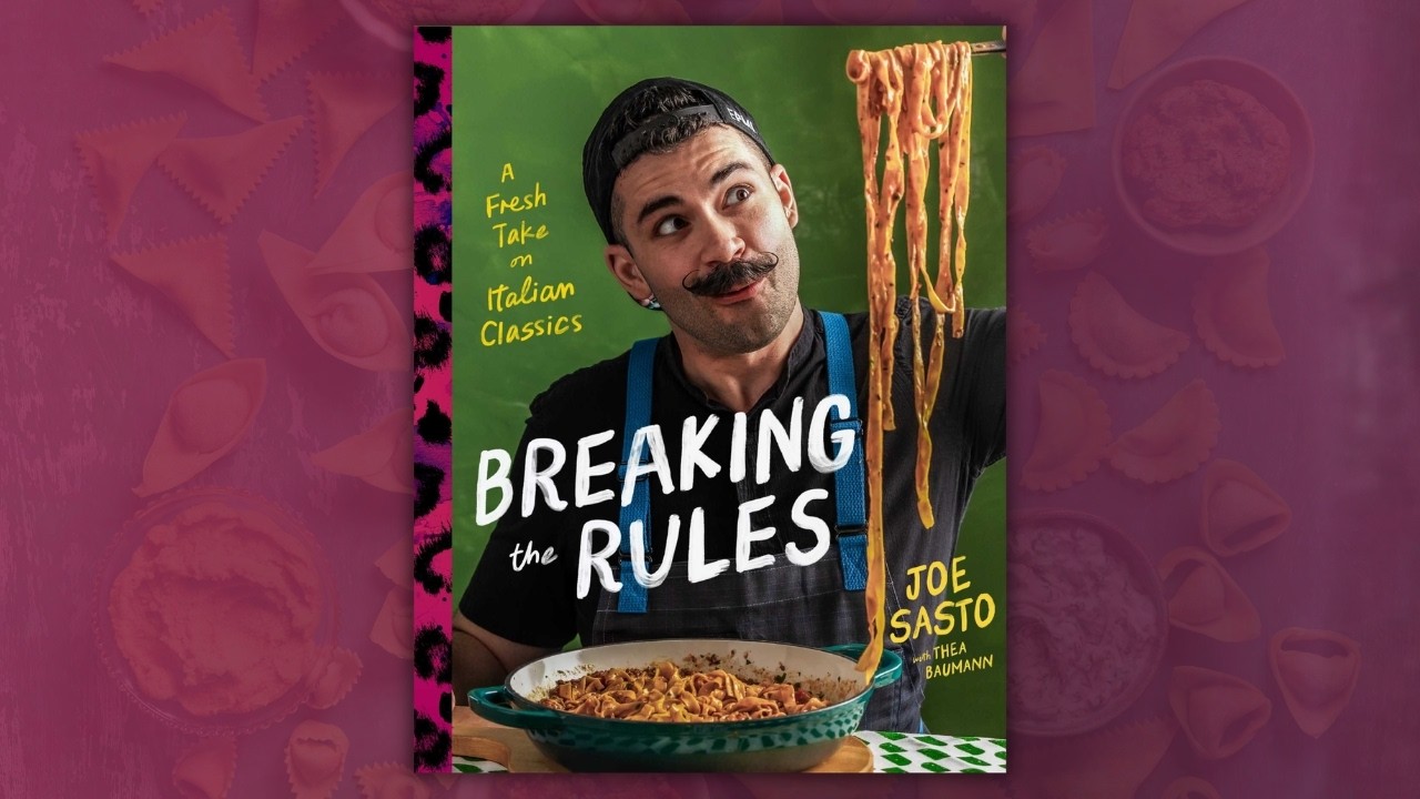 Man holding up pasta from a spoon