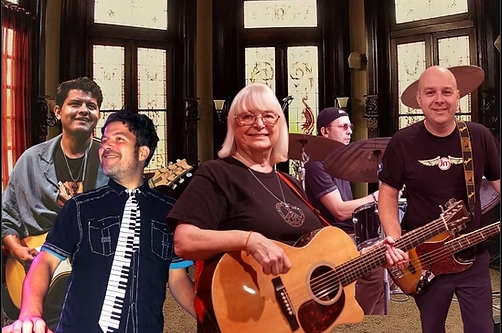 a band standing together posing for a phot holding musical instruments