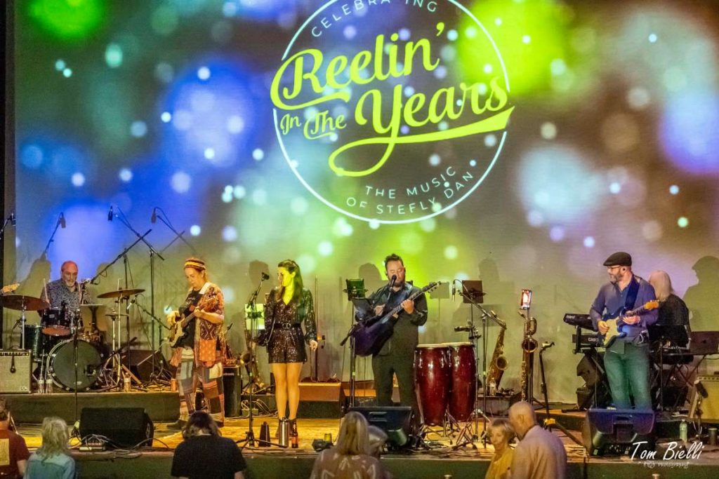 People performing music on a stage 