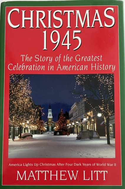 Book cover of Christmas 1945: The Story of the Greatest Celebration in American History by Matthew Litt. The cover features a snowy downtown street decorated with illuminated Christmas trees and holiday lights. Text at the bottom reads, “America Lights Up Christmas After Four Dark Years of World War II.”