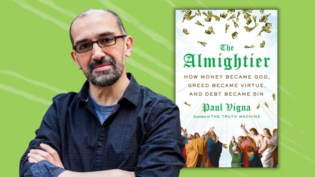 Man standing with his arms folded next to a photo of a book cover