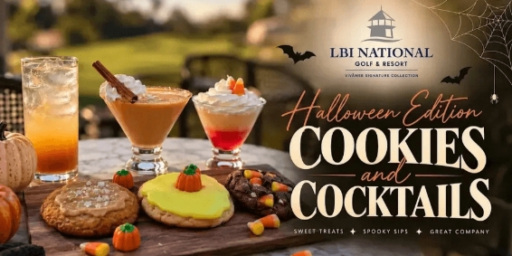 Halloween cocktails and themed desserts on a table